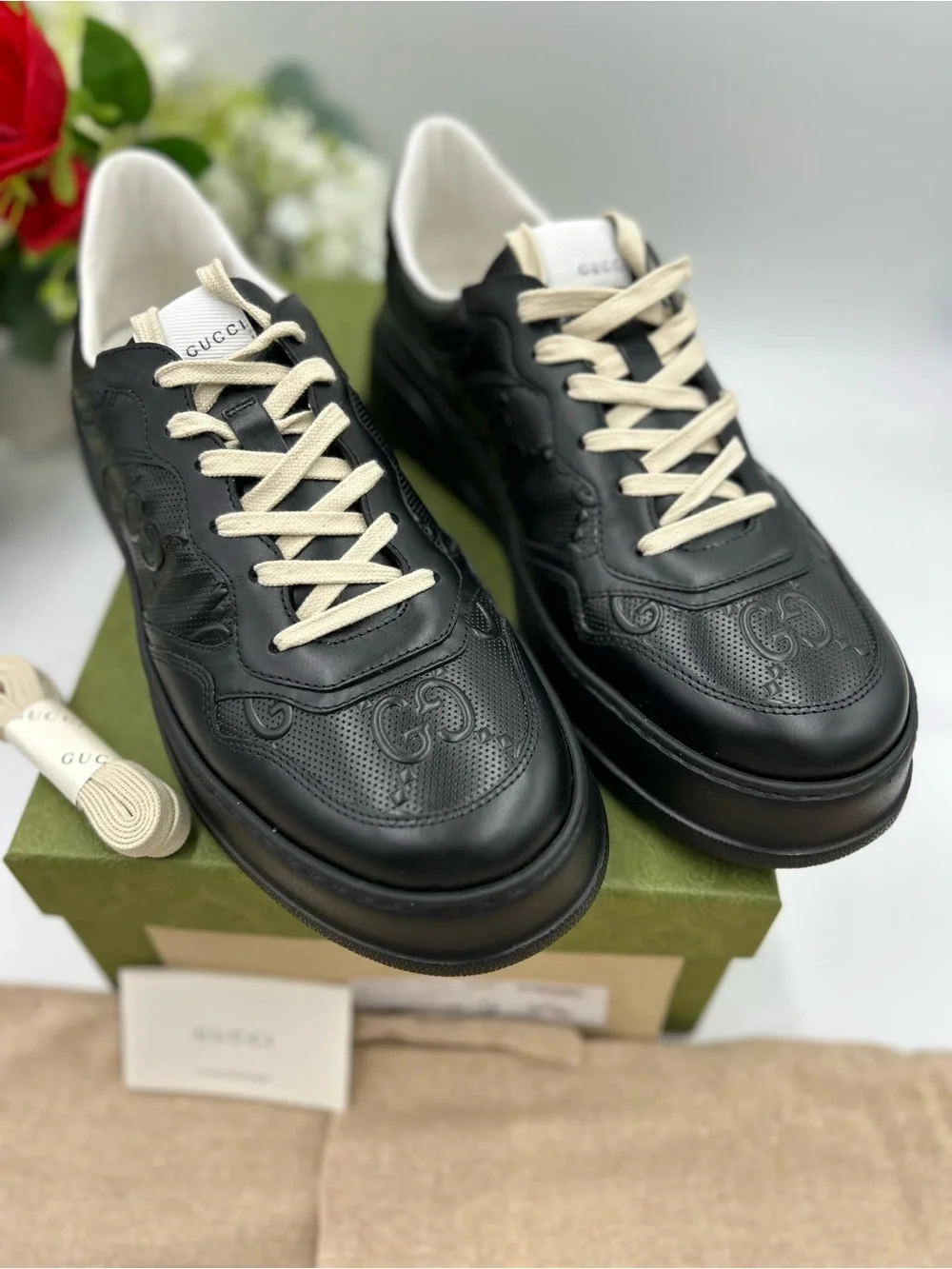 Men's Gucci, GG embossed, black leather sneakers size 11 fits 11.5 made in Italy